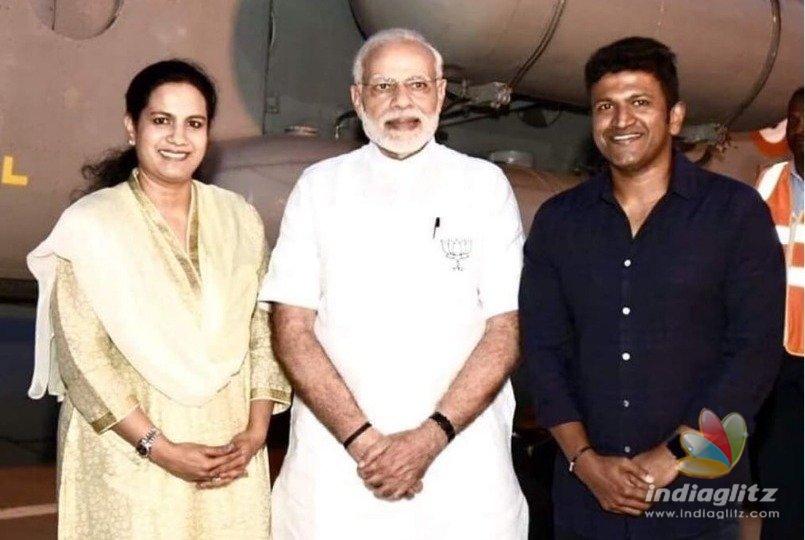 Puneeth present Raj book to PM Modi