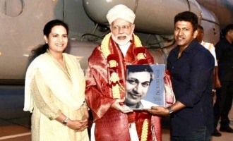 Puneeth present Raj book to PM Modi