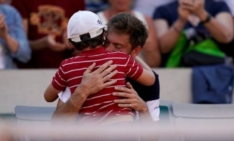 French Tennis Player Nicolas Mahut Comforted by Son after Loss
