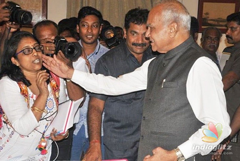 Governor gets into fresh controversy by patting female scribe’s cheeks