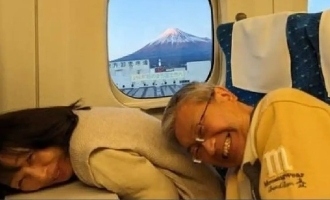 Japanese duo ducked down for passenger to take picture of Mount Fuji