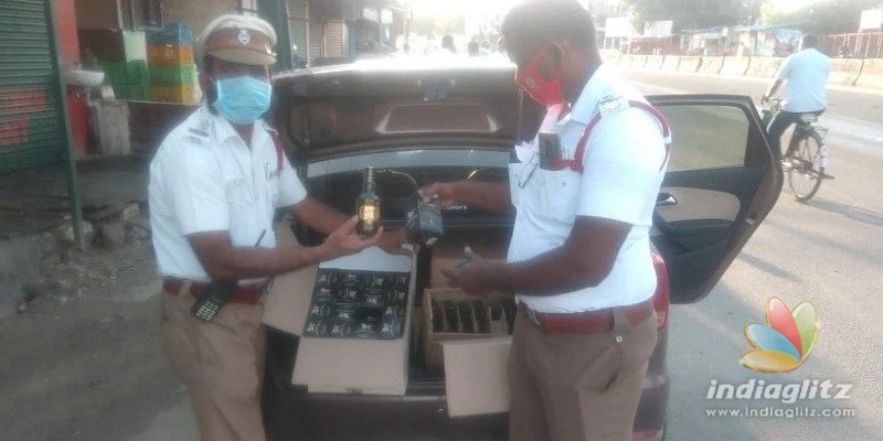 Tamil film producer arrested for smuggling illegal liqour bottles in fake police car