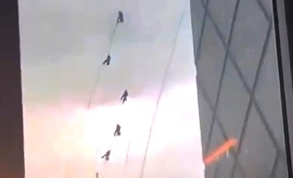 Beijing Windstorm: Workers Swing Wildly on CCTV Tower Amid High Winds