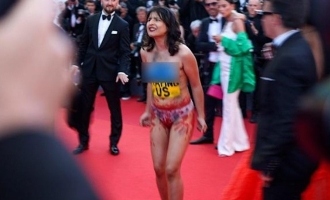 Woman shocks celebrities by stripping naked at Cannes Film Festival