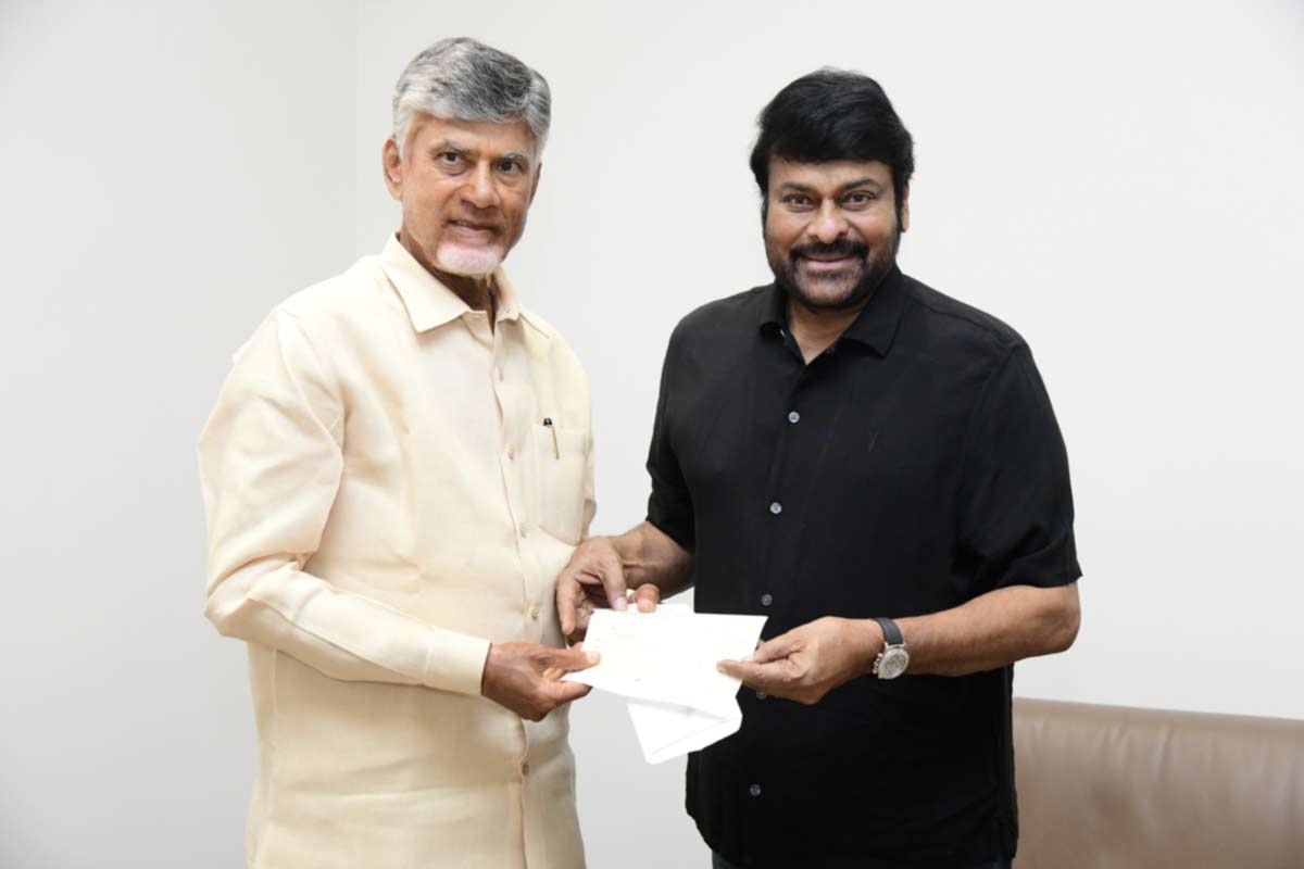 Chiranjeevi handover cheques for flood relief victims personally to AP CM Chandra Babu