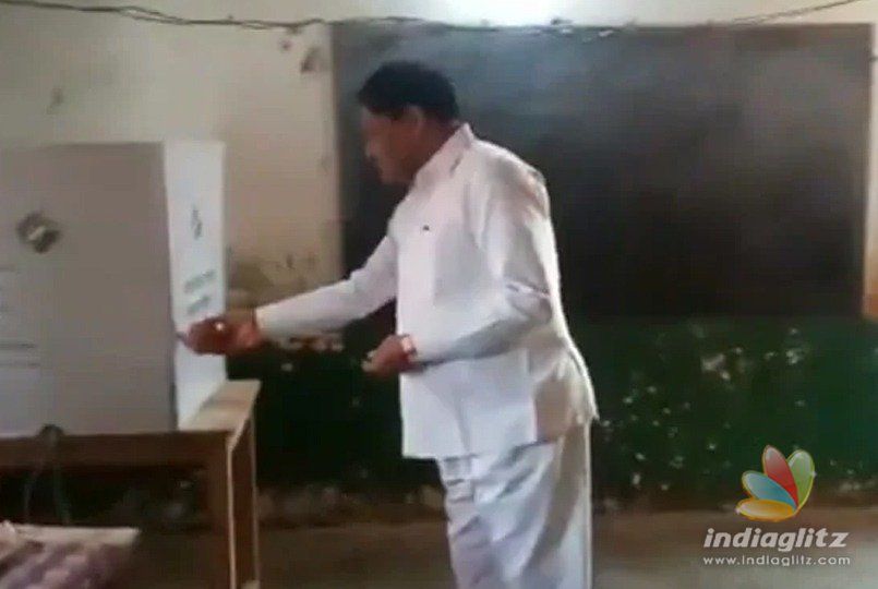 BJP Minister caught worshipping EVM inside booth!