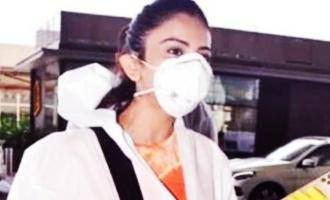 Covered in a PPE suit Rakul travels to Delhi to resume shooting